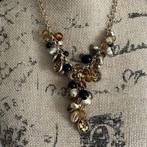 Charming Charlie gold, black and leopard statement necklace